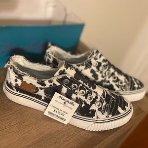 Cow print slip on sneakers